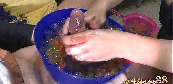  Young girl makes soft hanjob with lots of oil and water balls